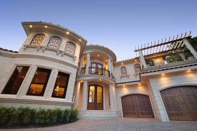 Mid-sized transitional beige two-story mixed siding exterior home photo in Miami