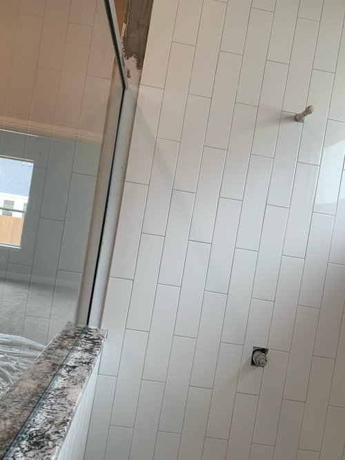 What is the correct way to finish our shower tile edges