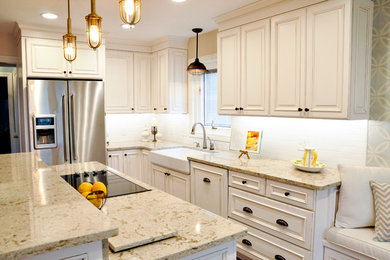 Kitchen - traditional medium tone wood floor kitchen idea in Other with a farmhouse sink, raised-panel cabinets, white cabinets, quartz countertops, white backsplash, subway tile backsplash, stainless steel appliances and an island