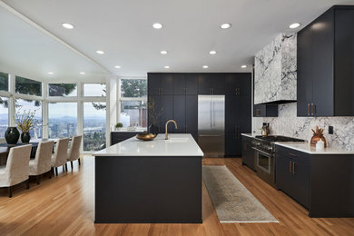 Large transitional l-shaped medium tone wood floor eat-in kitchen photo in Portland with an undermount sink, flat-panel cabinets, blue cabinets, quartz countertops, multicolored backsplash, quartz backsplash, stainless steel appliances, an island and white countertops