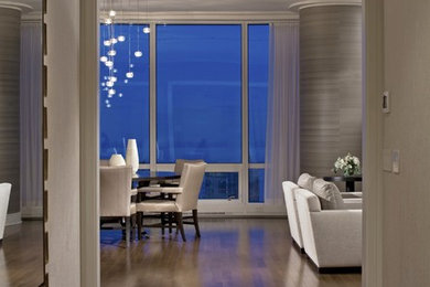 Example of a huge transitional medium tone wood floor foyer design in Chicago with white walls