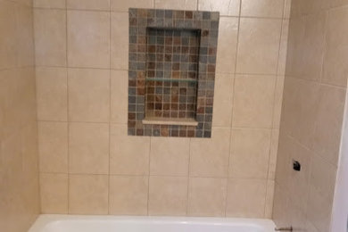 Bathroom - mid-sized modern master multicolored tile and slate tile slate floor, brown floor and single-sink bathroom idea in Detroit with furniture-like cabinets, dark wood cabinets, a two-piece toilet, multicolored walls, a console sink, quartz countertops, white countertops, a niche and a freestanding vanity
