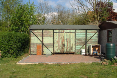 This is an example of a rural back garden with a potted garden.