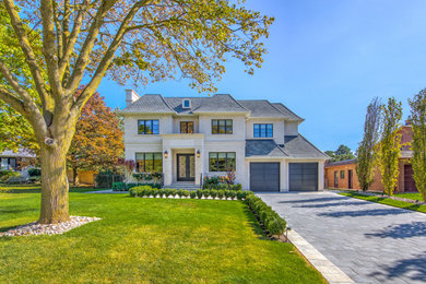 Example of a transitional home design design in Toronto