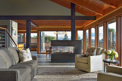 Living room - large contemporary open concept limestone floor living room idea in Seattle with beige walls and a metal fireplace