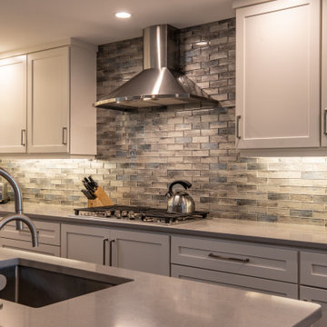 Transitional Two-Tone Kitchen | Shaker Cabinetry & Glass Mosaic Backsplash