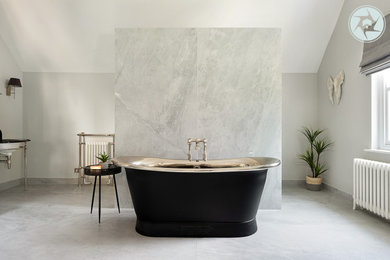 Design ideas for a large contemporary grey and black ensuite bathroom in Berkshire with a freestanding bath, a walk-in shower, grey walls, marble flooring, a pedestal sink, grey floors, an open shower and a single sink.