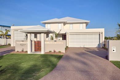 Inspiration for a large modern two-storey exterior in Cairns.
