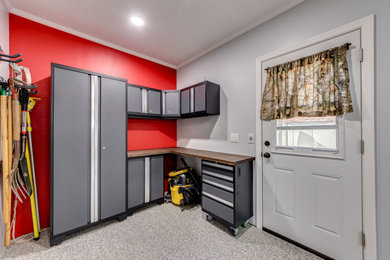 Example of a mid-sized transitional garage design in St Louis