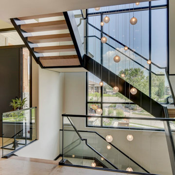 Long Modern Three-Story Staircase Voyage Chandelier