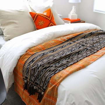 Modern Bedroom with Foo Dog Lamp and Orange Kilim Pillow