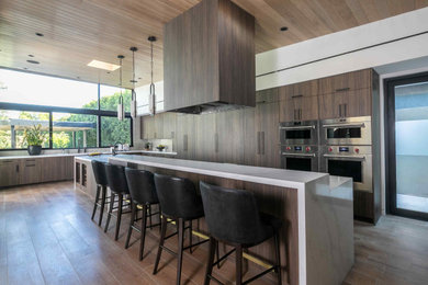 Inspiration for a huge contemporary wood ceiling open concept kitchen remodel in Los Angeles with flat-panel cabinets, dark wood cabinets, quartz countertops, ceramic backsplash, an island and white countertops