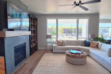 Minimalist living room photo in Boise with a plaster fireplace