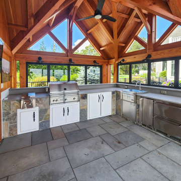 Grilling Station Framed by Open NanaWall Windows on Every Side