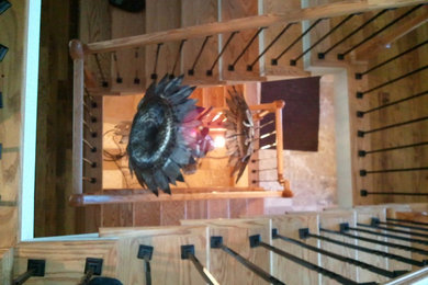 Inspiration for a huge craftsman wooden u-shaped mixed material railing staircase remodel in Other with painted risers