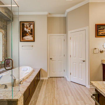 Warm Master Bathroom With Hints of the Outdoors