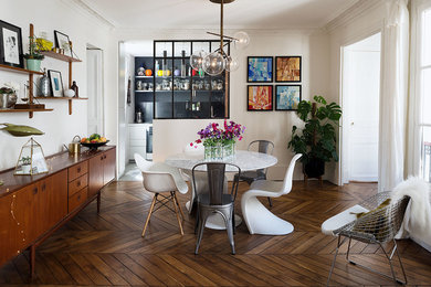 Design ideas for a large contemporary open plan dining in Paris with white walls, dark hardwood floors, no fireplace and brown floor.
