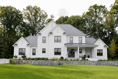 Inspiration for a large transitional white three-story painted brick house exterior remodel in Richmond with a hip roof, a metal roof and a gray roof