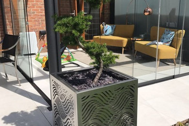 This is an example of a modern patio in West Midlands.