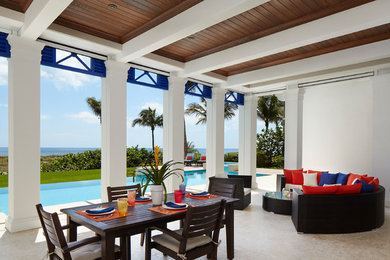 Example of an island style patio design in Miami