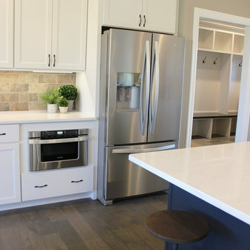Blue Kitchen Island in Edgebrooke Homes Bettendorf, Iowa Kitchen