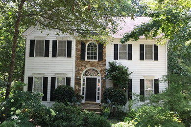 Inspiration for a mid-sized timeless green three-story concrete fiberboard gable roof remodel in Atlanta