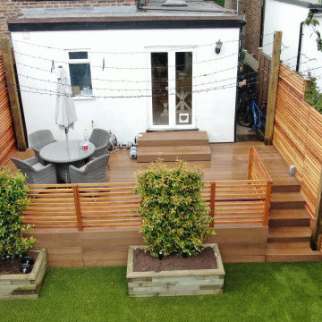 Millboard deck, artificial grass and cedar slat fencing in Reigate