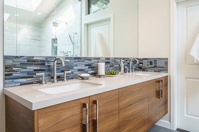 Walk-in shower - large modern master multicolored tile and porcelain tile porcelain tile walk-in shower idea in San Francisco with an undermount sink, flat-panel cabinets, medium tone wood cabinets, quartz countertops, an undermount tub, a one-piece toilet and gray walls