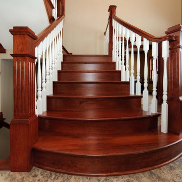 Flared Staircase with Bowed American Cherry Front Treads and Poplar Balusters