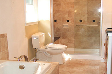 Photo of a large transitional master bathroom in Chicago with a drop-in tub, an alcove shower, a two-piece toilet, beige tile, ceramic tile, white walls and ceramic floors.