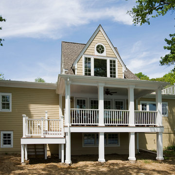 French Revival Remodel With Covered Porch Backyard View