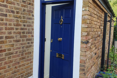 Inspiration for a front door in London with a single front door and a blue front door.