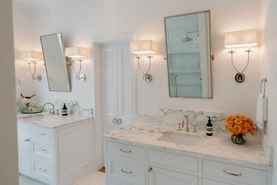 This is an example of a medium sized traditional ensuite bathroom in Charleston with beaded cabinets, white cabinets, grey tiles, stone tiles, white walls, mosaic tile flooring, a submerged sink, marble worktops, multi-coloured floors, a hinged door, grey worktops, a shower bench, double sinks and a built in vanity unit.