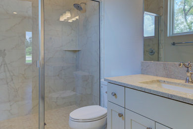 Inspiration for a mid-sized traditional kids bathroom in Austin with flat-panel cabinets, white cabinets, an undermount tub, a curbless shower, a two-piece toilet, white tile, porcelain tile, white walls, porcelain floors, an undermount sink, granite benchtops, white floor, a hinged shower door, white benchtops, a shower seat, a single vanity, a built-in vanity, wallpaper and wood walls.