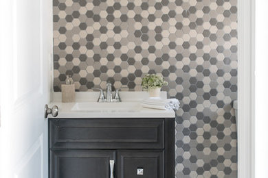 Example of a small transitional multicolored tile and porcelain tile porcelain tile and beige floor bathroom design in New York with raised-panel cabinets, dark wood cabinets, a one-piece toilet, white walls and laminate countertops