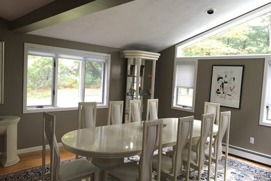 Enclosed dining room - large modern light wood floor and brown floor enclosed dining room idea in Boston with gray walls and no fireplace