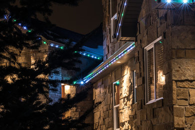 Huge two-story stone exterior home idea in Denver