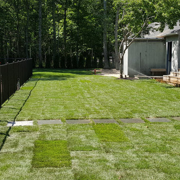 Backyard Makeover Installing Sod, Privacy Hedge, Flower Garden, Gravel Driveway