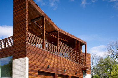 Example of a huge trendy multicolored two-story wood exterior home design in Chicago