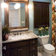 behind toilet cabinet
