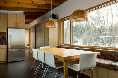 Inspiration for a rustic ceramic tile and gray floor dining room remodel in Other with white walls