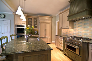 Large elegant u-shaped light wood floor eat-in kitchen photo in Charlotte with a double-bowl sink, raised-panel cabinets, beige cabinets, granite countertops, multicolored backsplash, subway tile backsplash, stainless steel appliances and an island