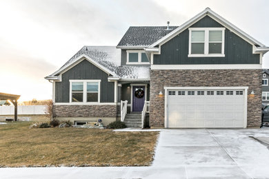 Large craftsman gray two-story concrete fiberboard and board and batten house exterior idea in Toronto with a shingle roof and a black roof