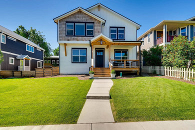 Cottage white two-story mixed siding house exterior photo in Denver with a shingle roof
