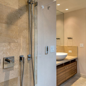 Limestone shower with Dornbracht shower controls