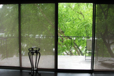 Balcony - small modern balcony idea in Nashville with no cover