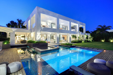 Inspiration for a large modern white two-story mixed siding exterior home remodel in Malaga