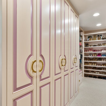 Luxurious Walk-In Closet with Custom Cabinets and Elegant Shoe Display
