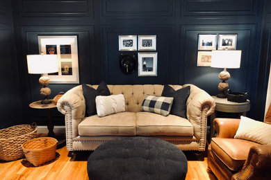 Living room - mid-sized traditional light wood floor living room idea in New York with blue walls