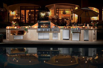 Patio kitchen - large coastal backyard concrete patio kitchen idea in Vancouver with no cover